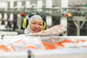 King Salmon employee sorting packages Ora Salmon